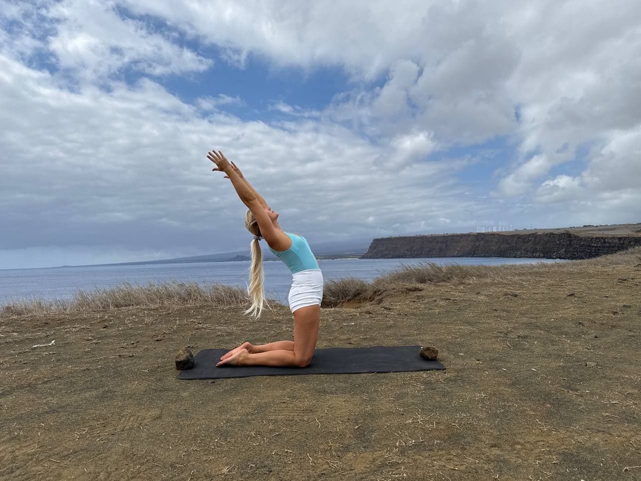Yoga master on the shore of Pacific ocean in Hawaii